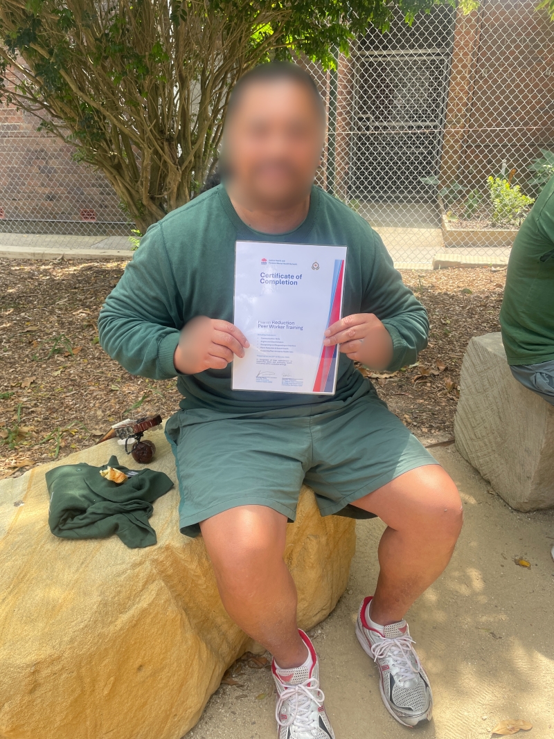 Man holding a certificate