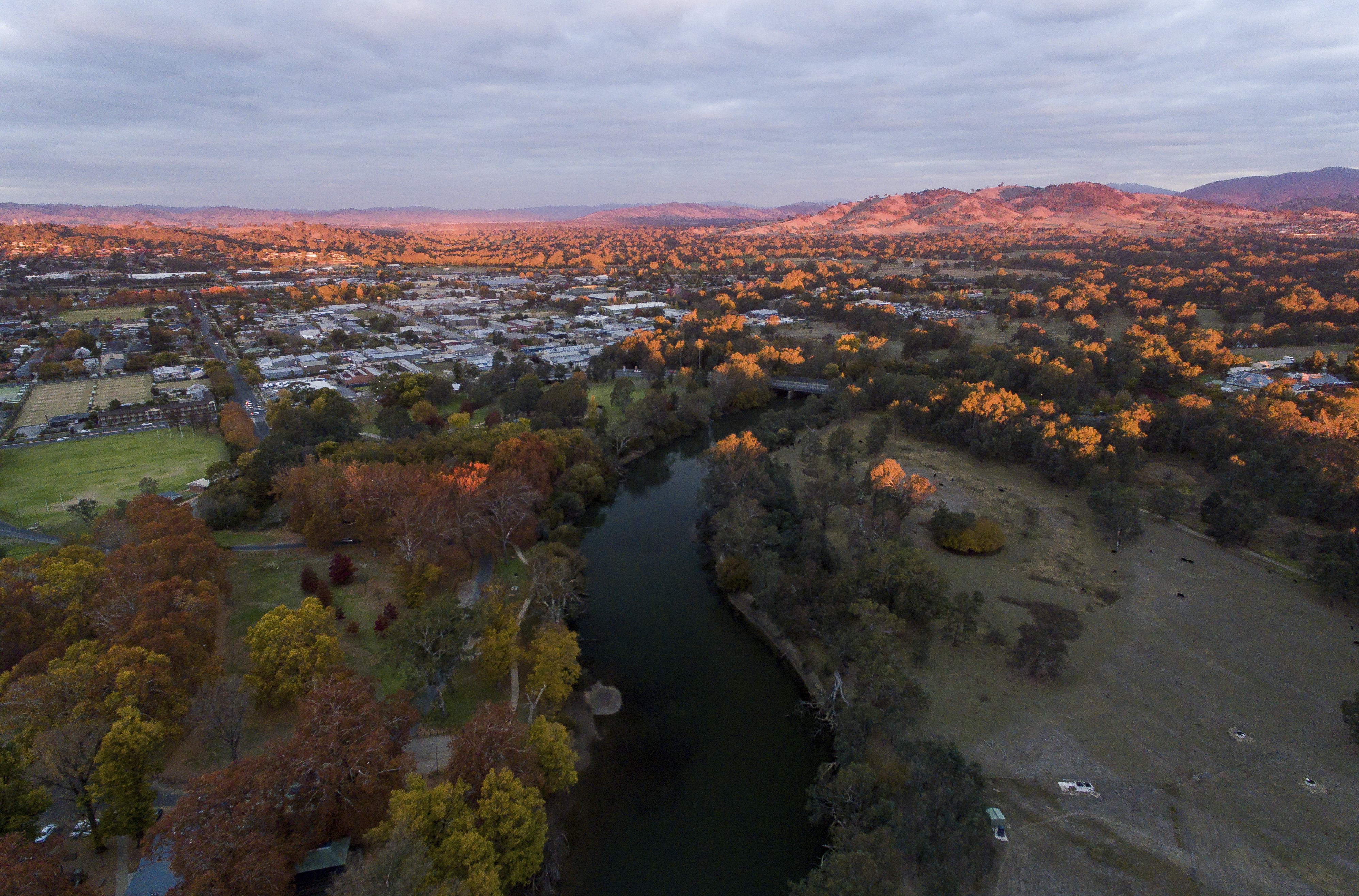 An aerial photo of Albury township at dusk