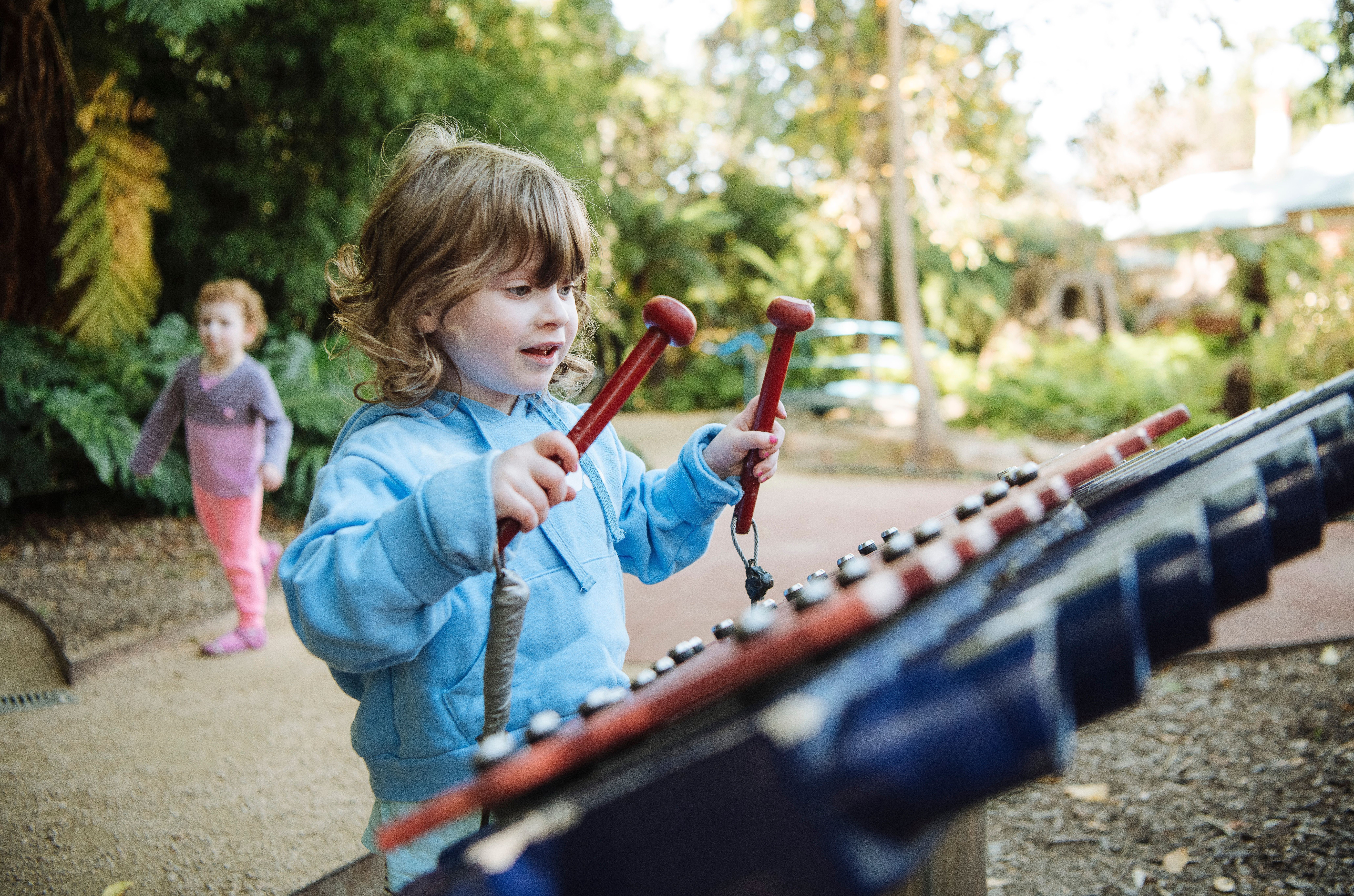 A photo of a child playing at Albury Botanic Gardens