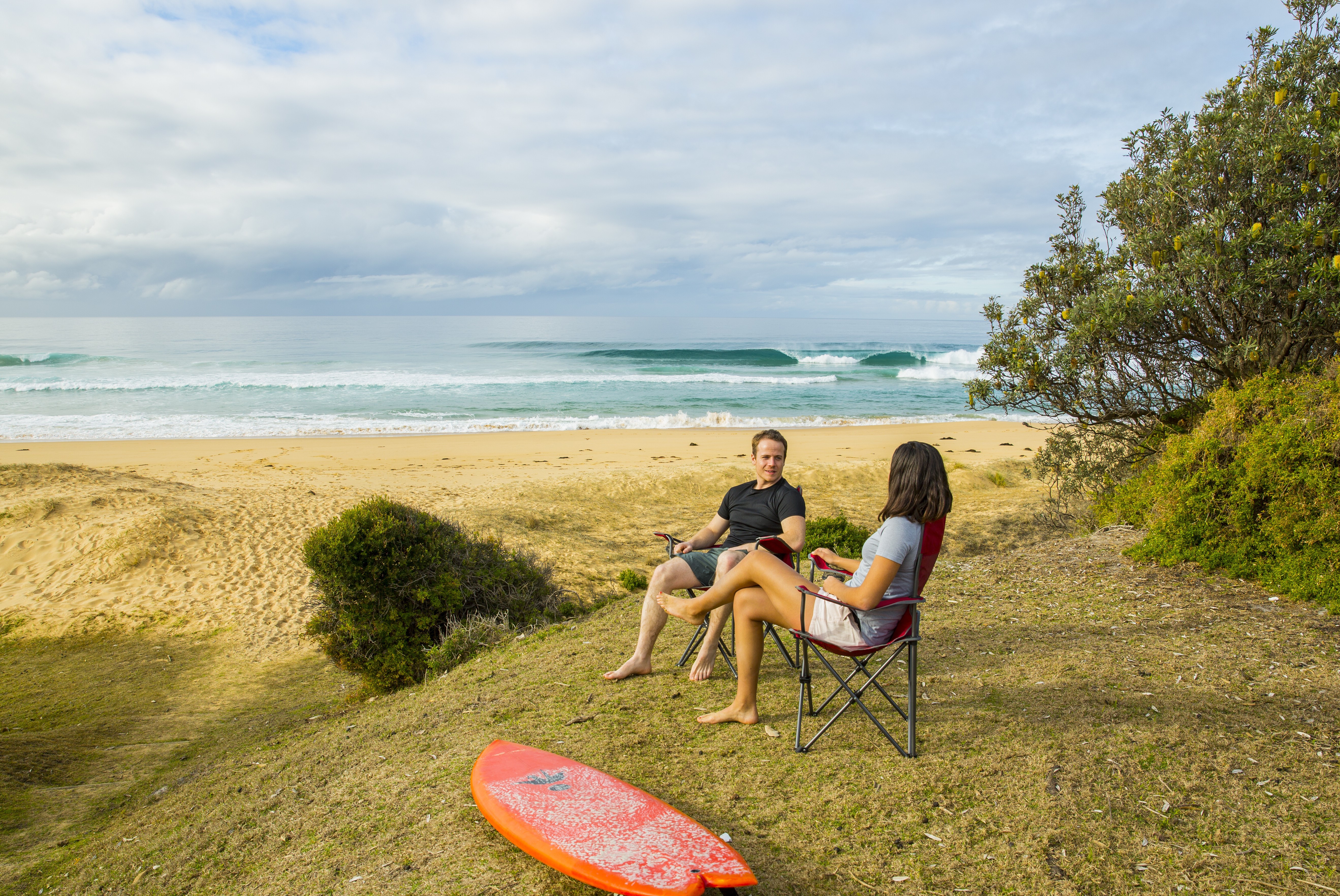 People relaxing near the water at Mimosa Rocks National Park