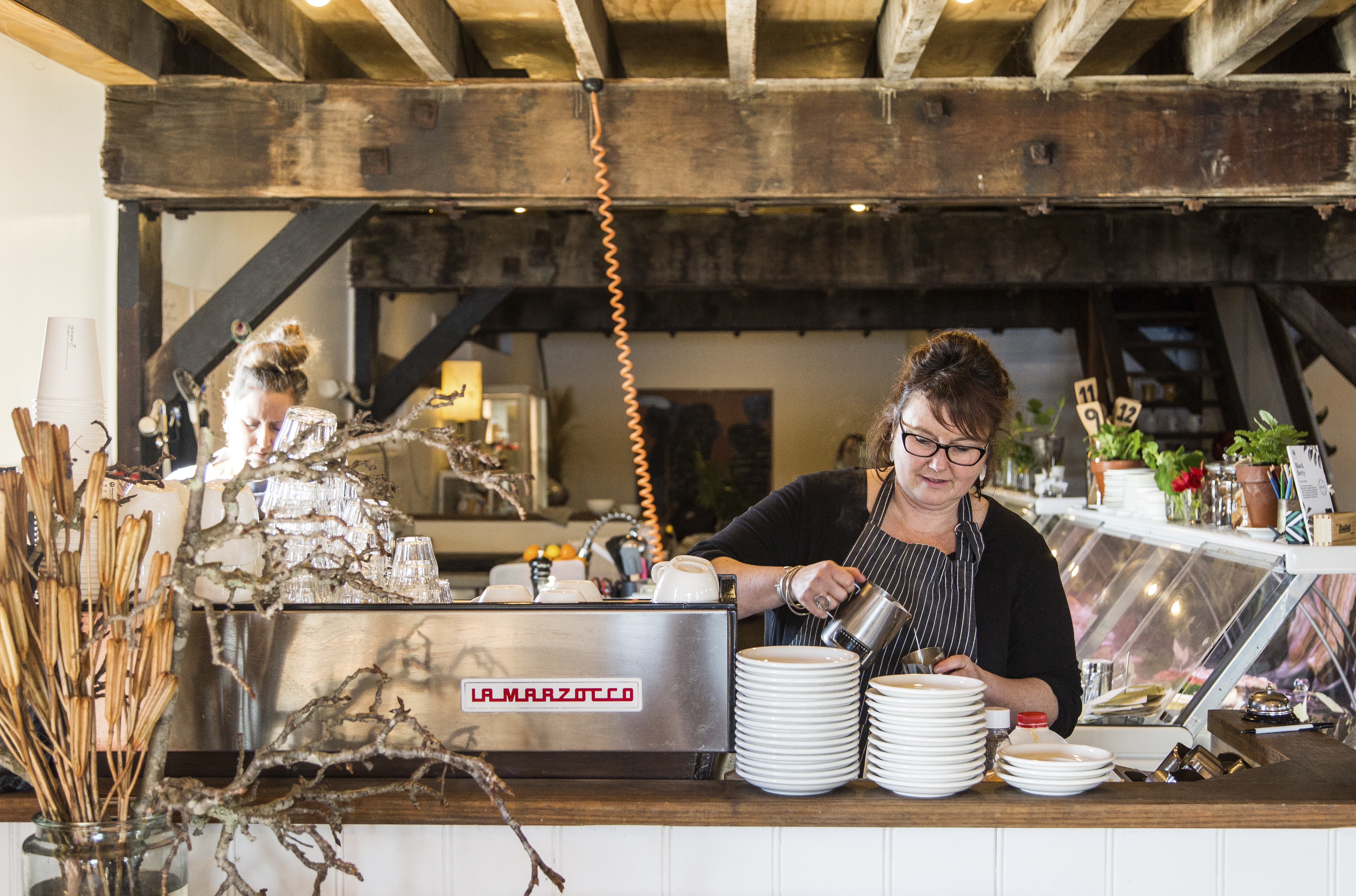 A photo of a barista at The Wharf Local in Tathra