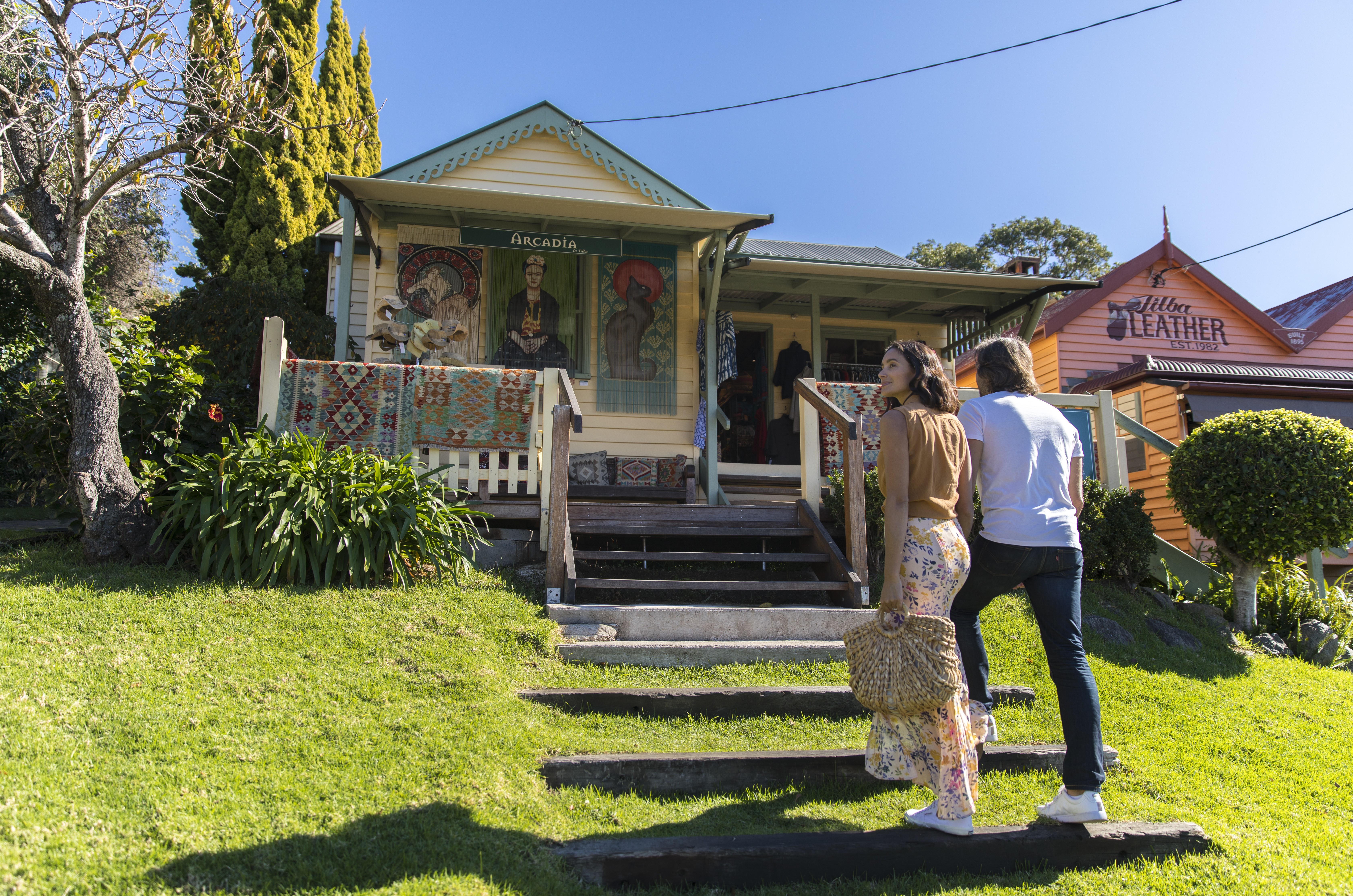A photo of a couple approaching shops in Central Tilba