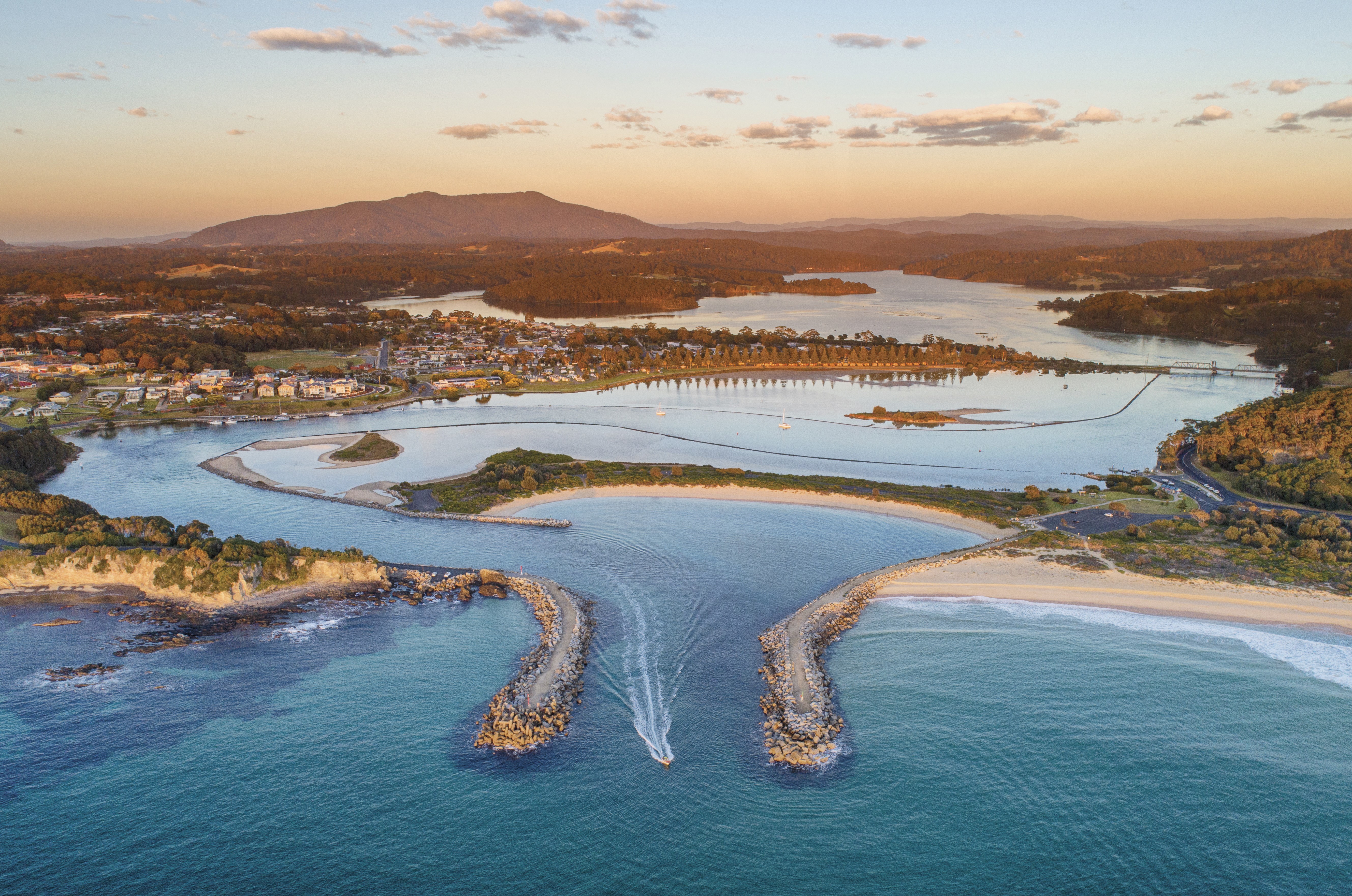 An aerial photo of Wagonga Inlet in Narooma at sunset