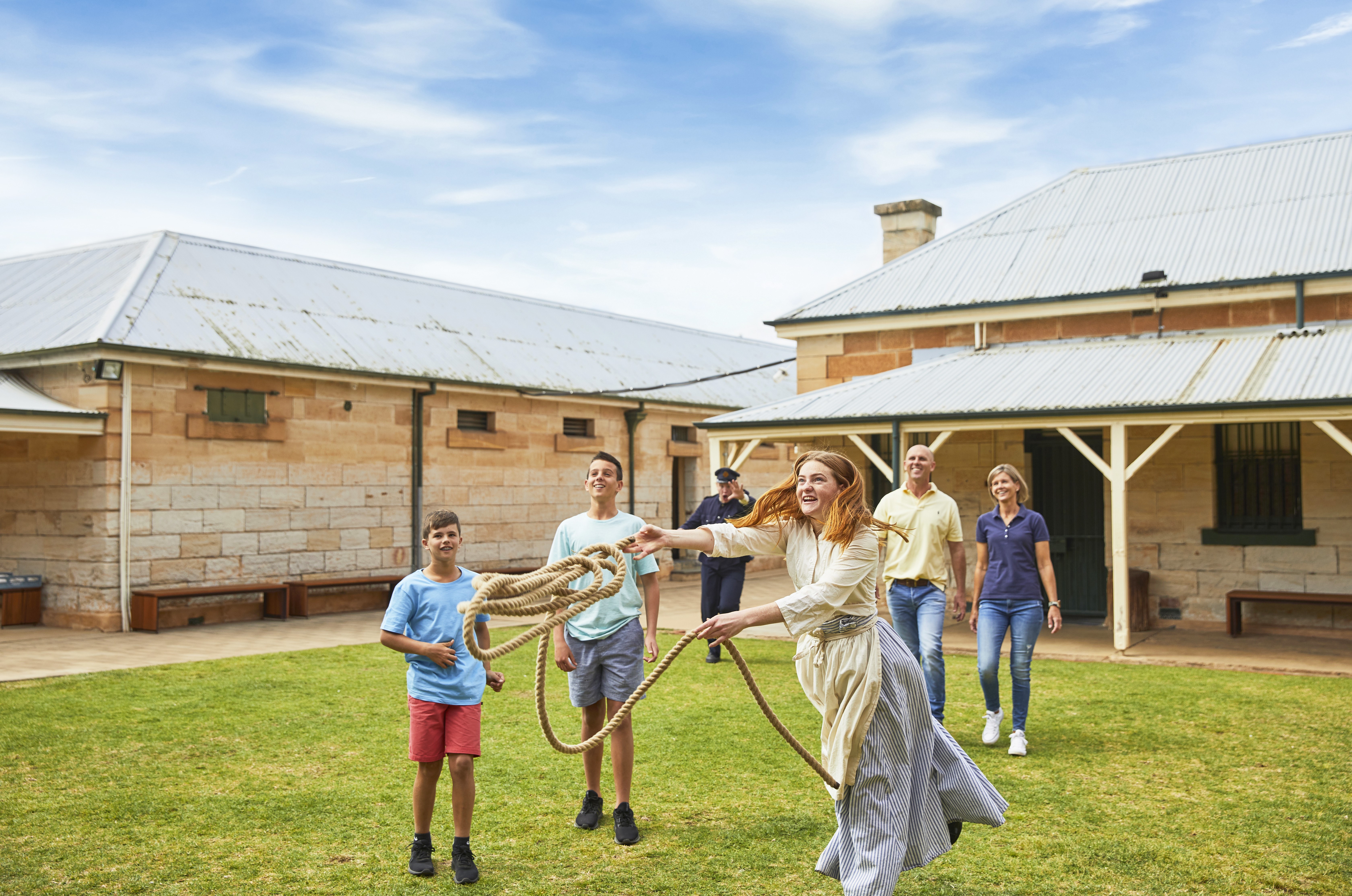 A photo of a family having fun on the lawn at Old Dubbo Gaol