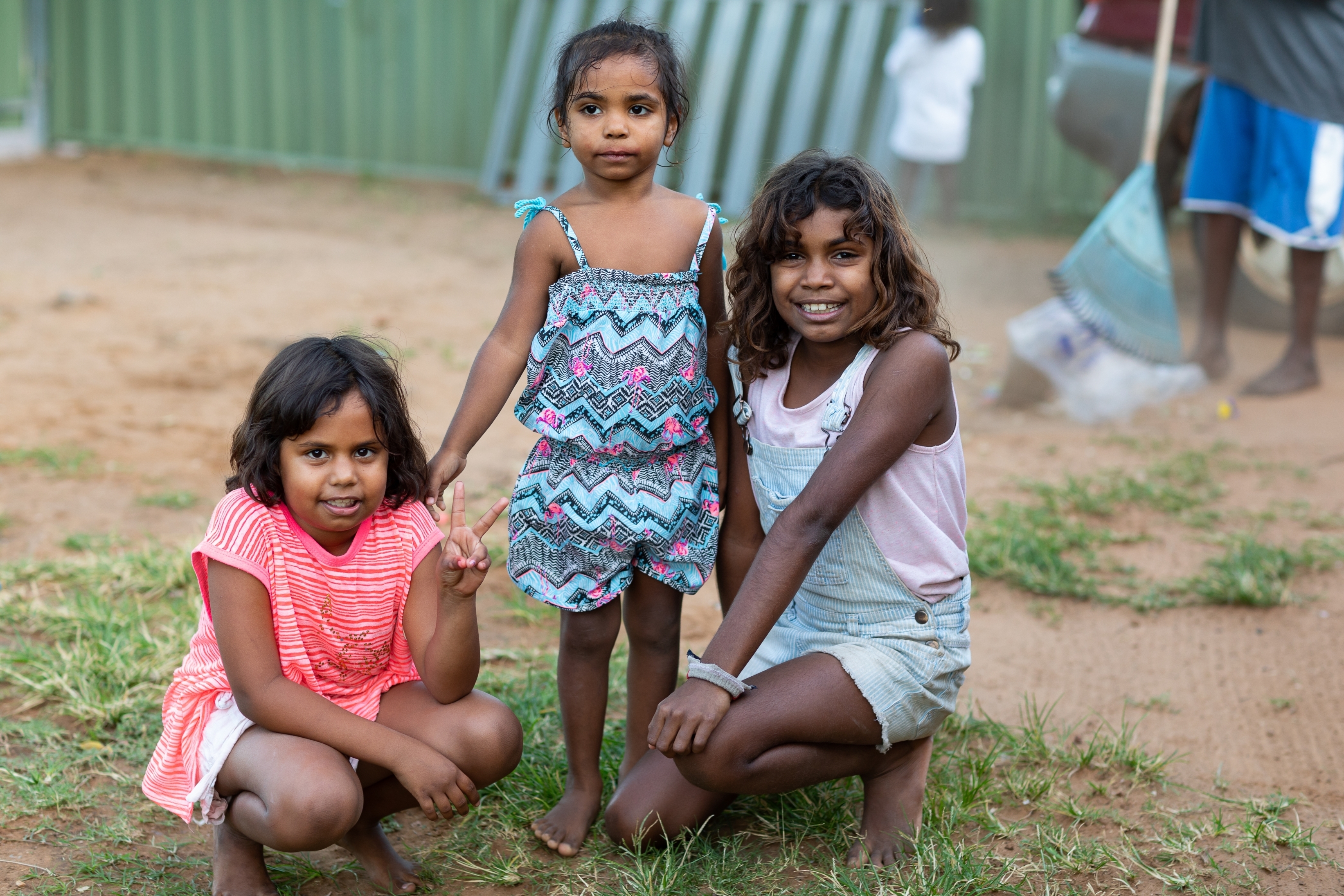 three little girls smiling at the camera