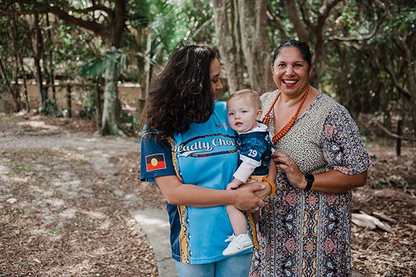 Picture of Jada and  Caseworker Tash holding Amaya