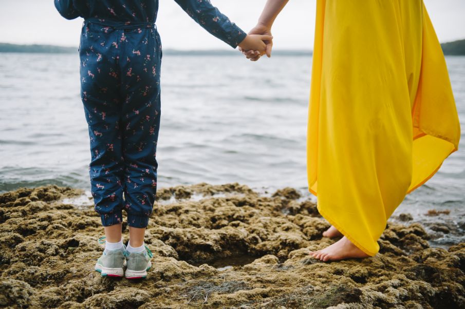Ann Marie and her daughter holding hands