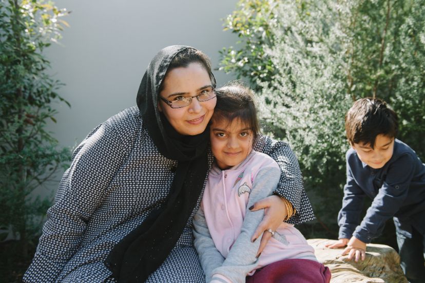 A photo of Aisha hugging her daughter 