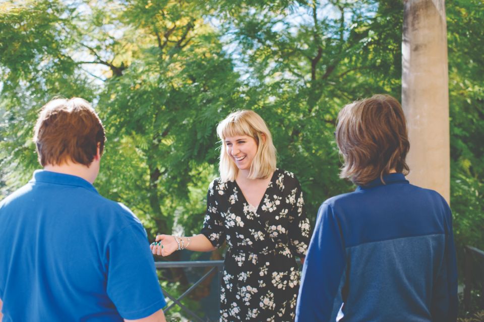 A photo of Freya talking to Tony and another young person