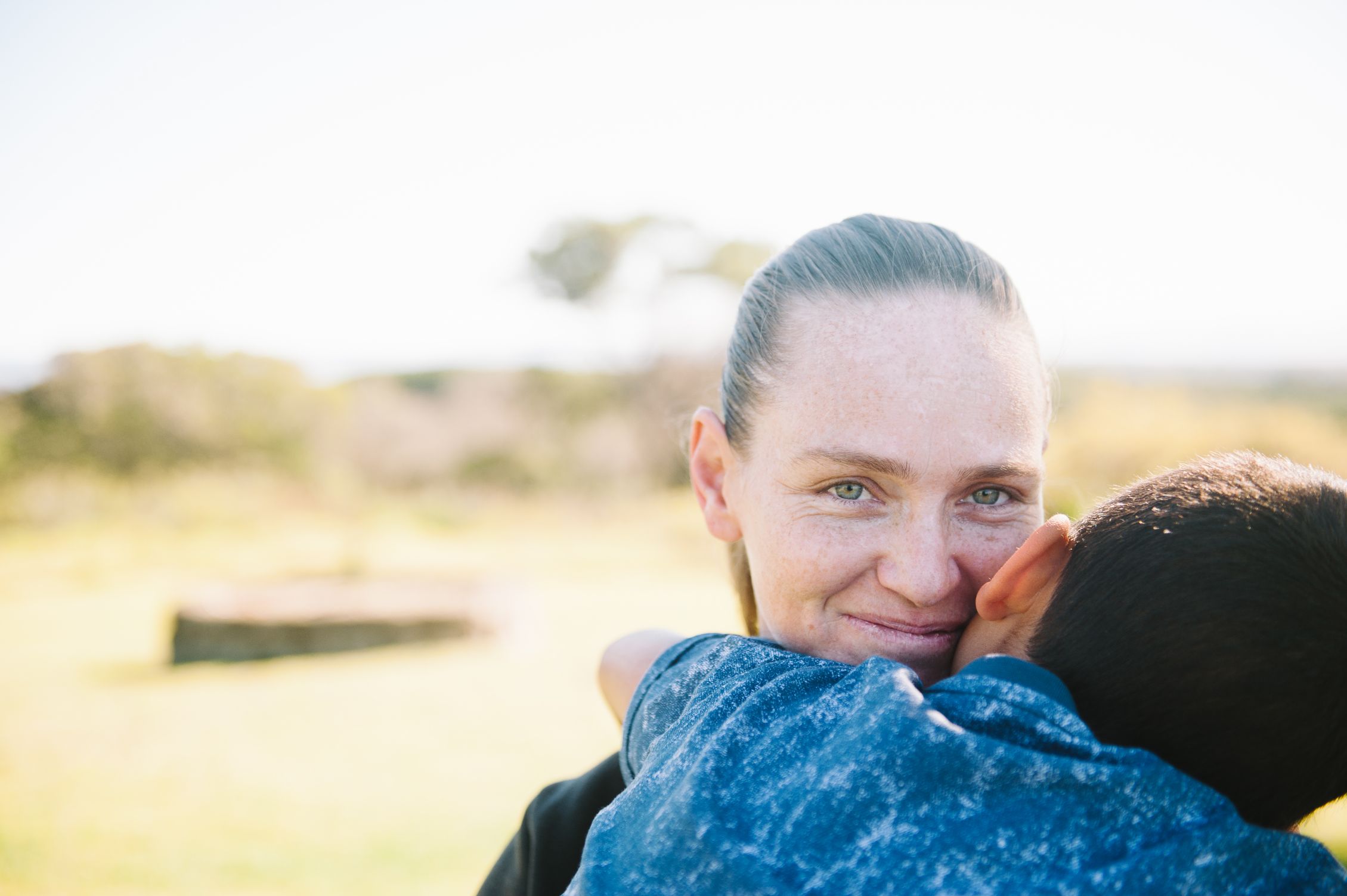 Sheri hugging her son