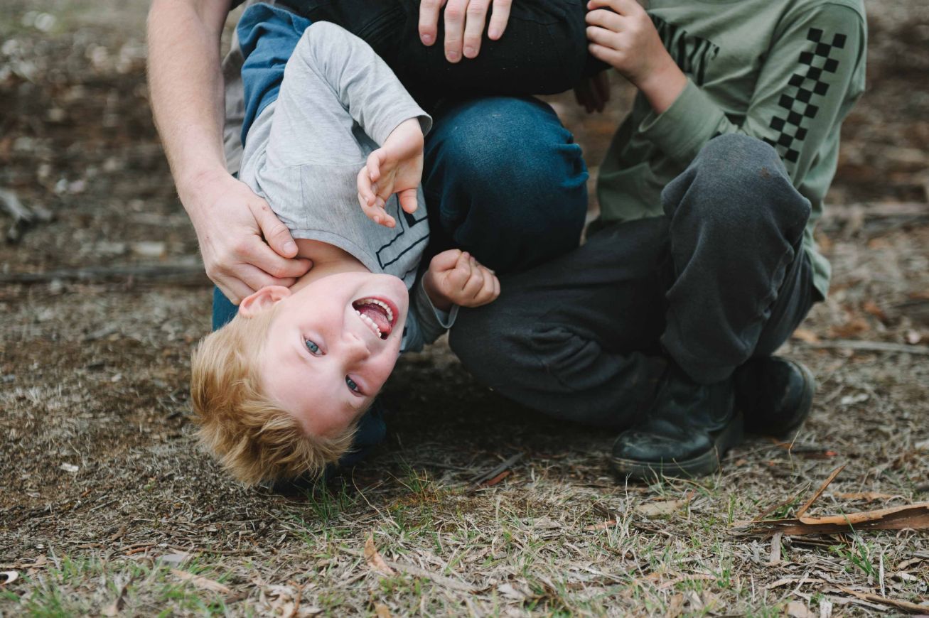 Adam and his sons playing on the ground