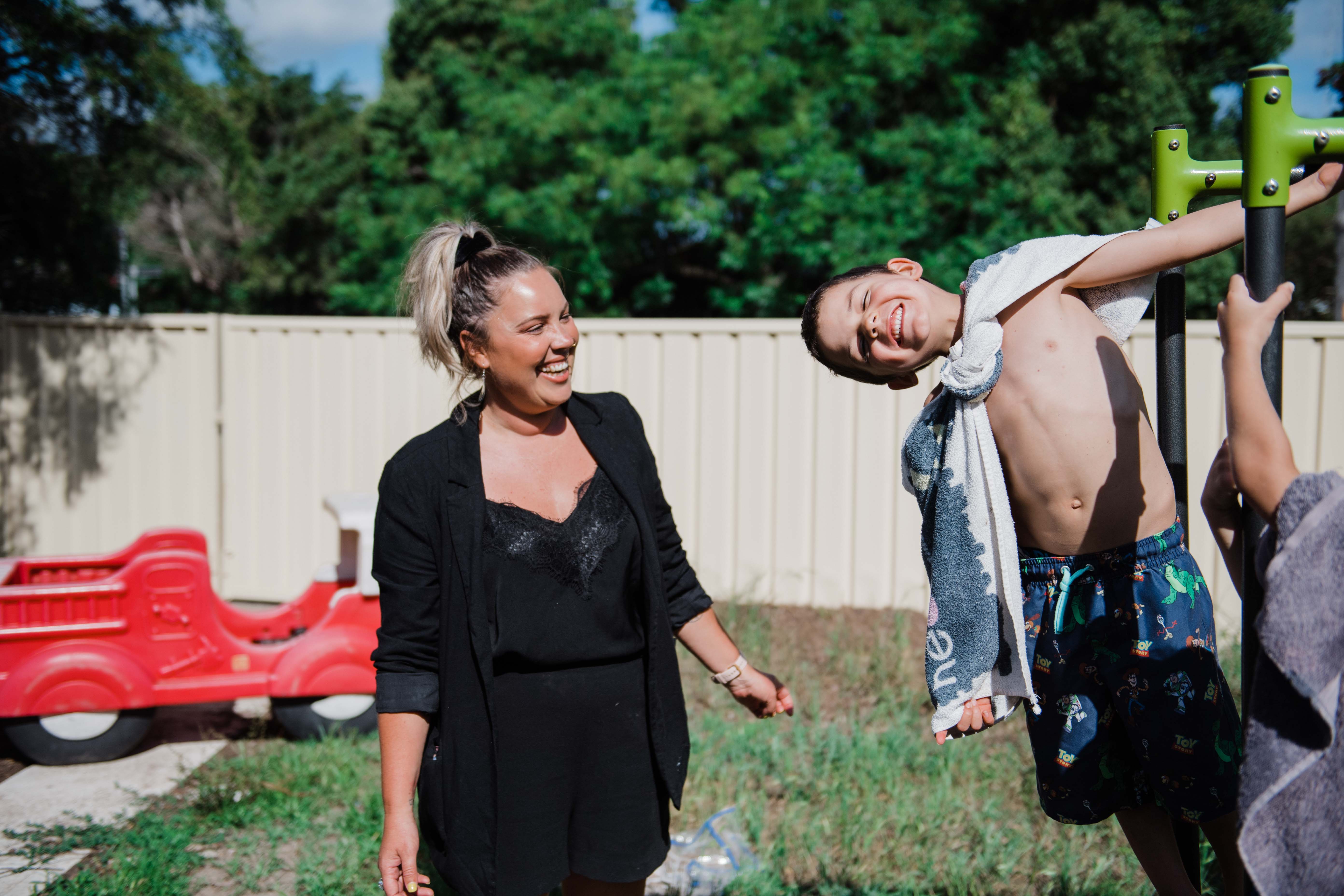 Katherine and one of Clorinda's children smiling and playing together 