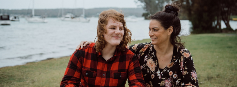Amber sits with Harry in the park.