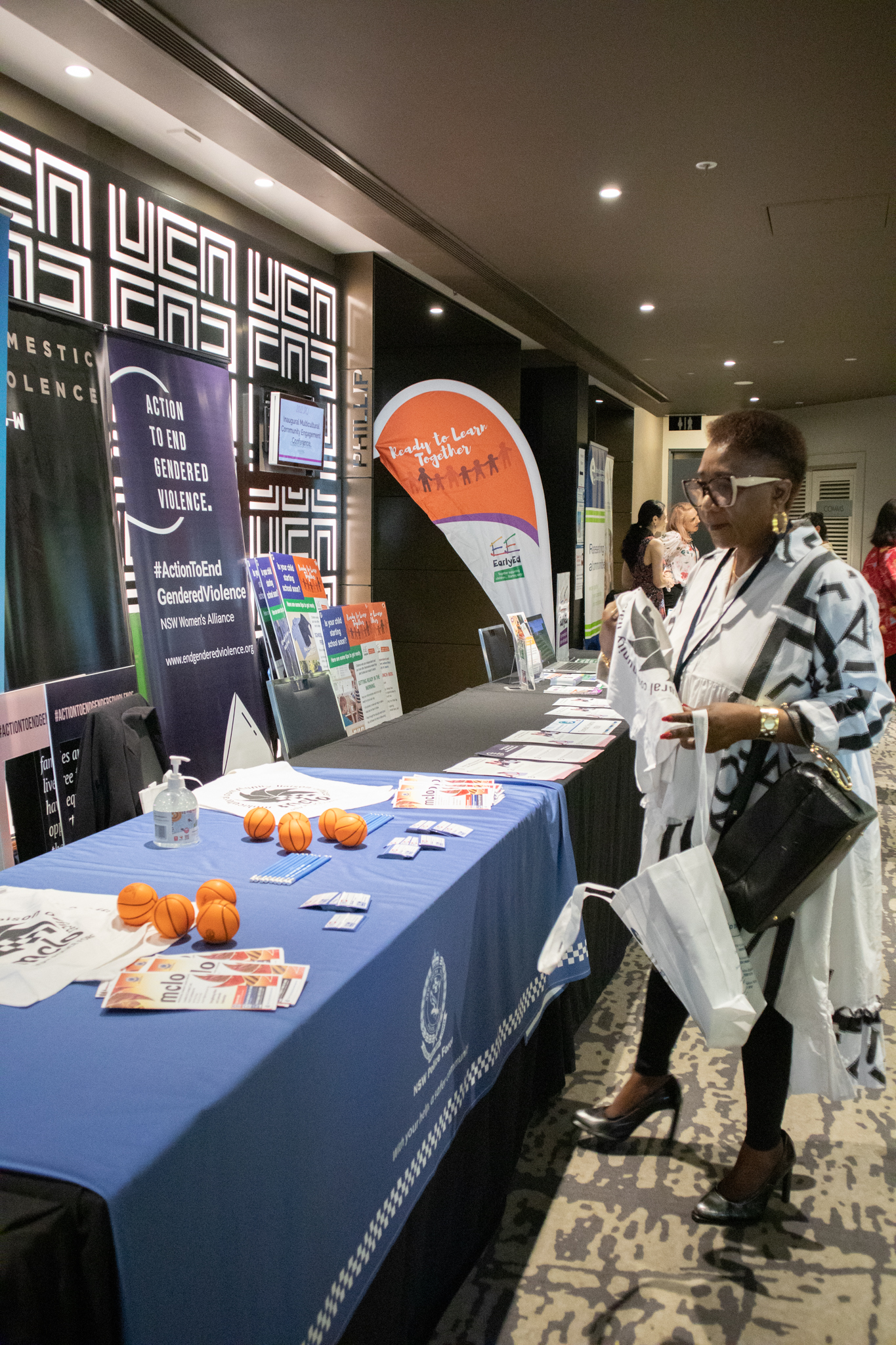 Three people at a registration desk