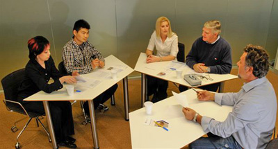 Group of people chatting at table